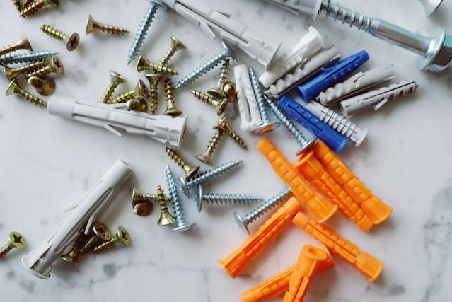 Photo of metal screws and plastic anchors