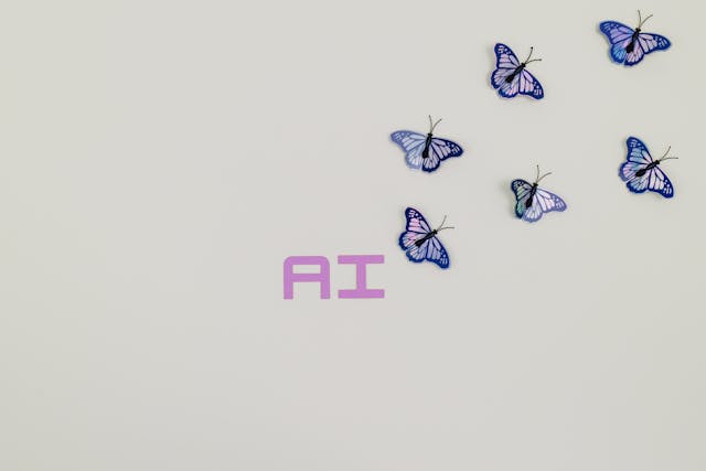 Picture of the letters AI with purple butterflies
