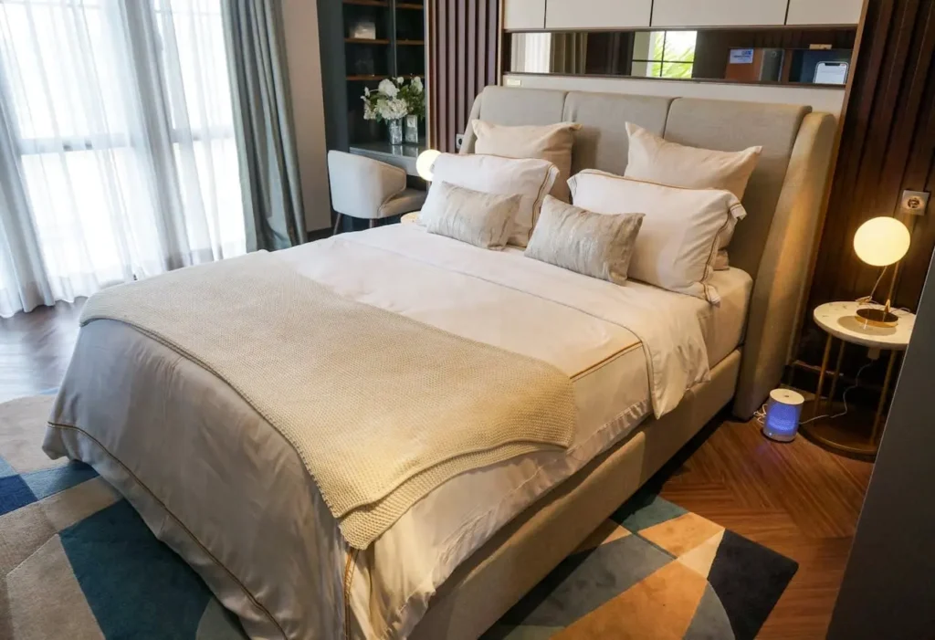 Photo of a stylish bed in a beautiful bedroom